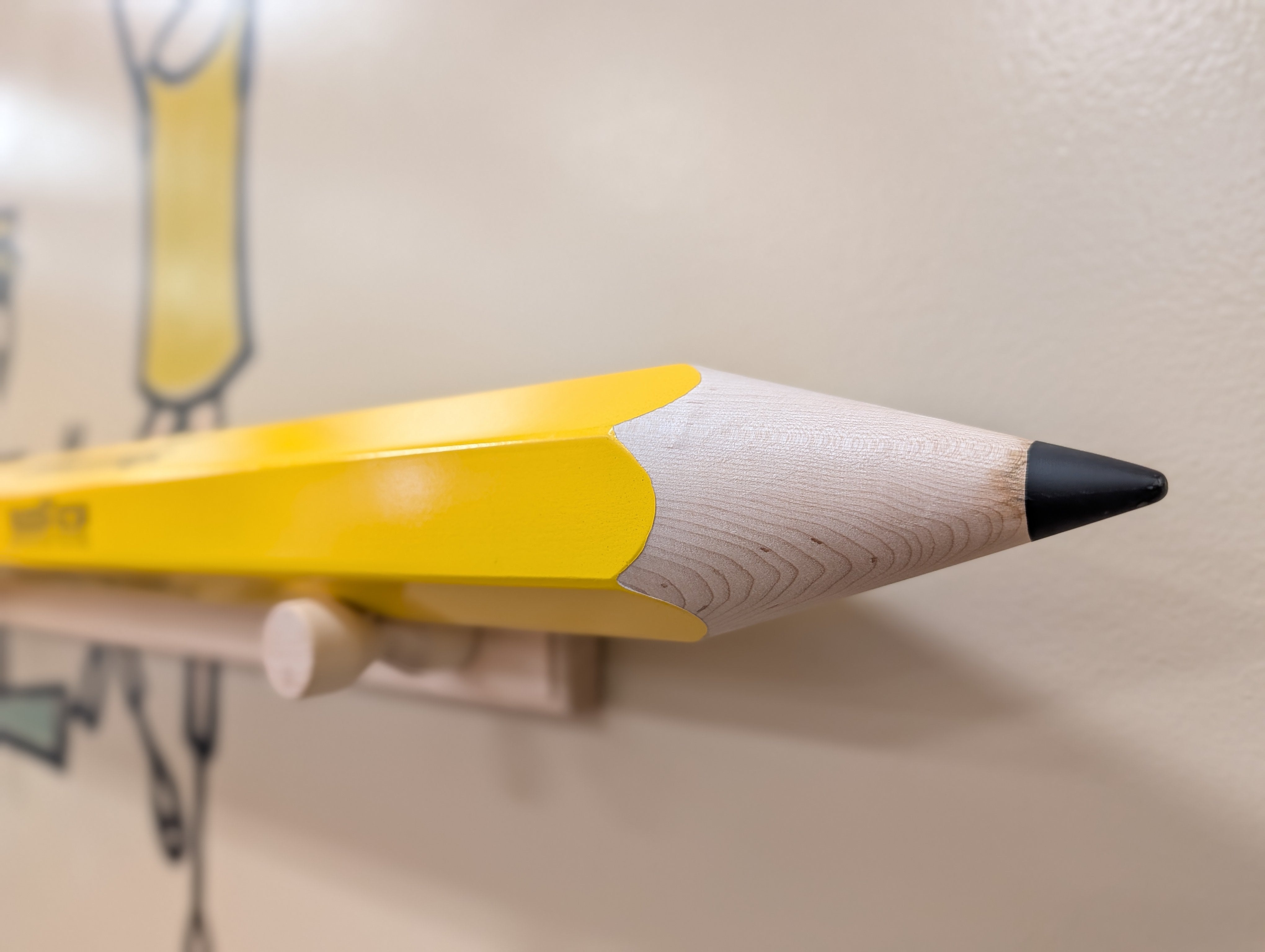 Real personalized giant maple pencil showing the sharpened wood point